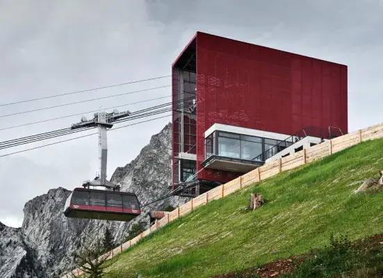 Cable car roof with expanded metal mesh painted red