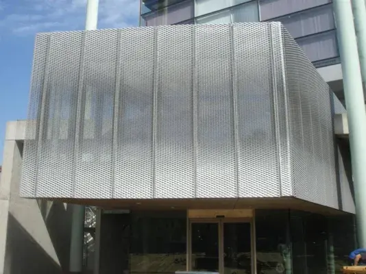 Facade with expanded metal sunshade panels